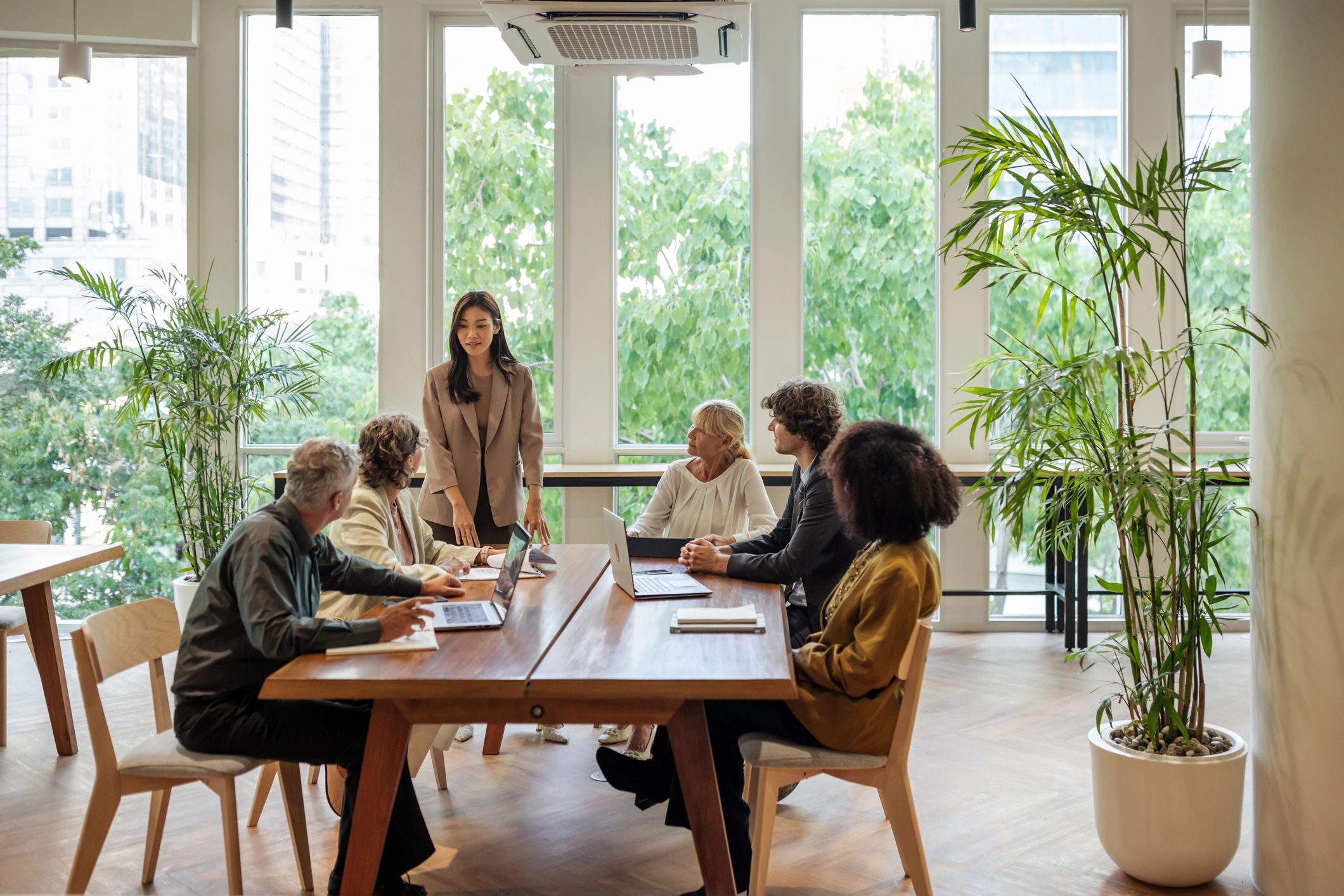 Real estate professionals meeting to review closing documents