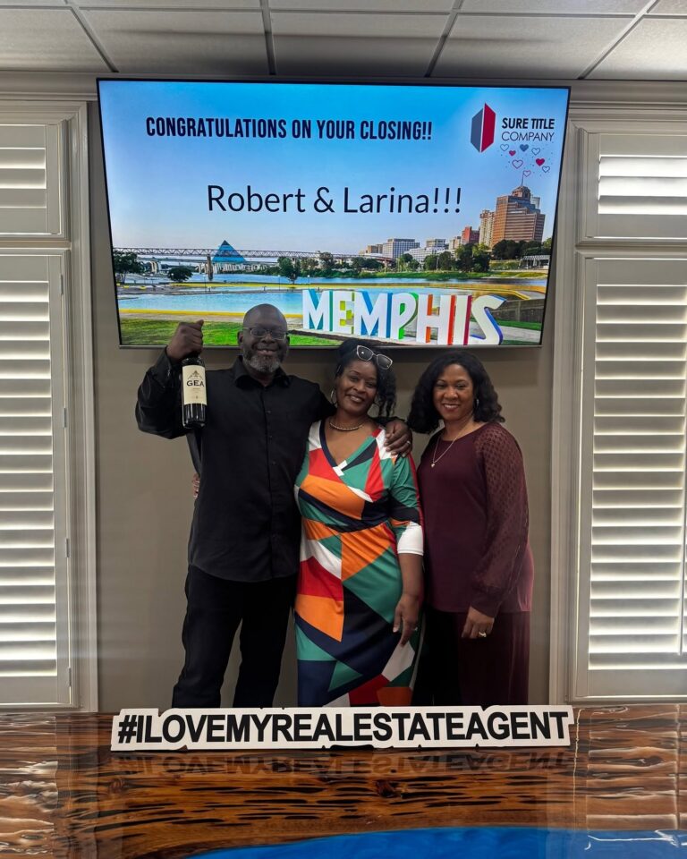 Happy clients and Realtors celebrating closing day at Sure Title Company, Memphis