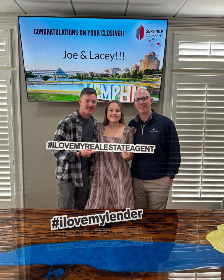Happy clients and Realtors celebrating closing day at Sure Title Company, Memphis