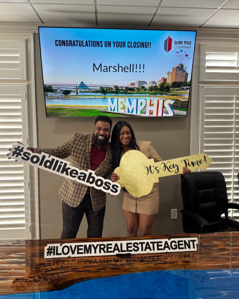 Happy clients and Realtors celebrating closing day at Sure Title Company, Memphis